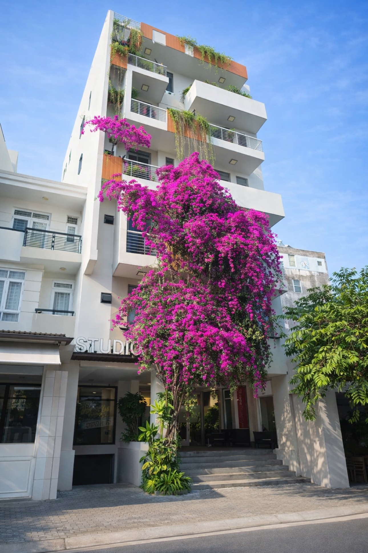 Studio79 building exterior with balconies and bougainvillea in Phu My Hung, District 7